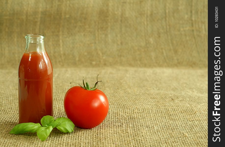 Tomato juice and tomato on beige background. Tomato juice and tomato on beige background