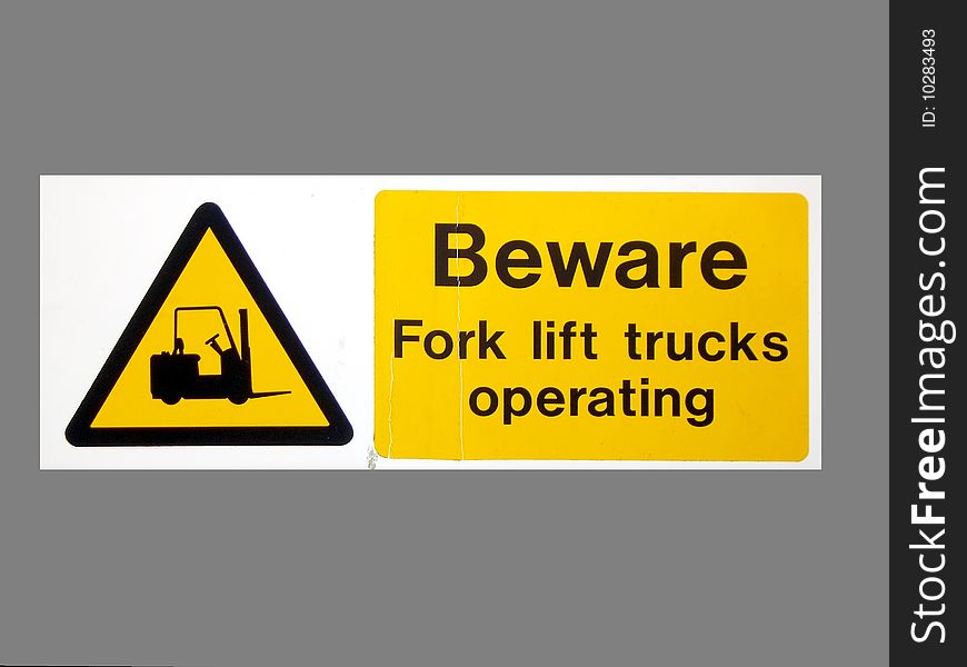 Sign warning of potential danger from fork-lift trucks operating. Sign warning of potential danger from fork-lift trucks operating