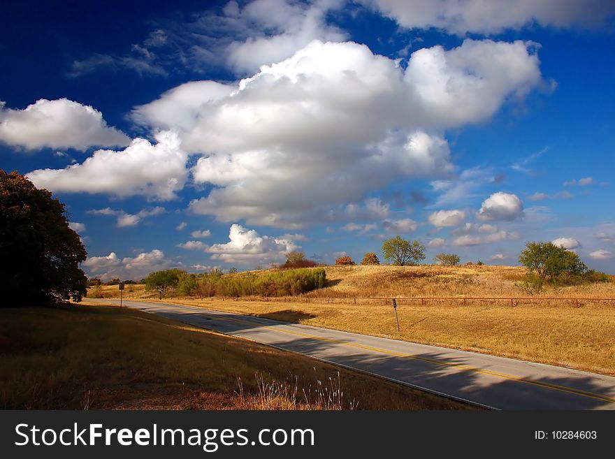 A country road with beautiful sky and scenery