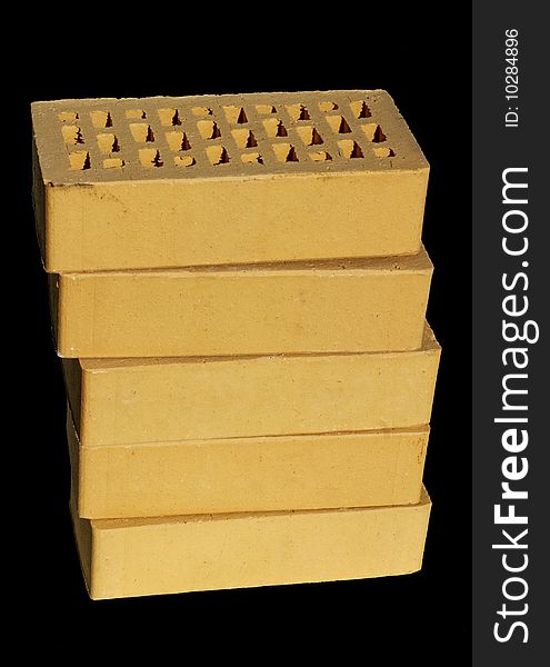 High quality clinker yellow bricks isolated on black. High quality clinker yellow bricks isolated on black