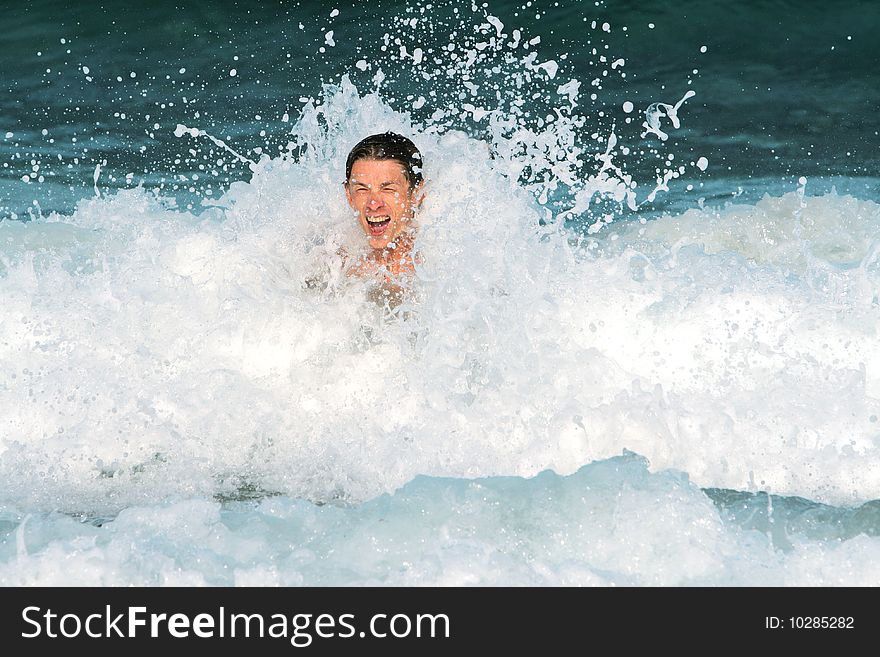 Young man has Fun in the Water