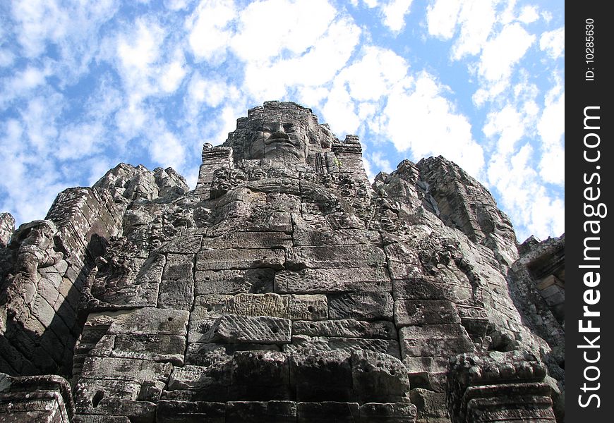 Photo of an iconic face on the bayon temple near siem reap, cambodia. Photo of an iconic face on the bayon temple near siem reap, cambodia.