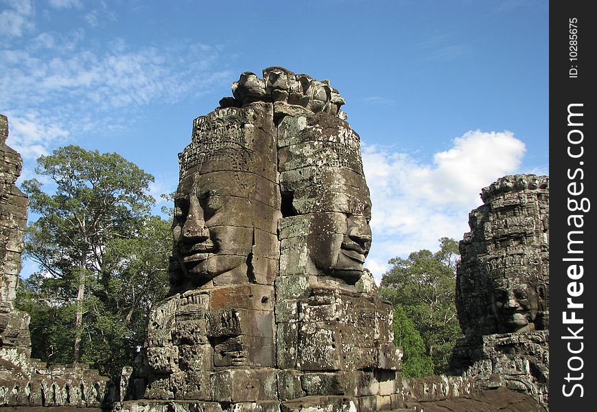 Photo of an iconic face on the bayon temple near siem reap, cambodia. Photo of an iconic face on the bayon temple near siem reap, cambodia.