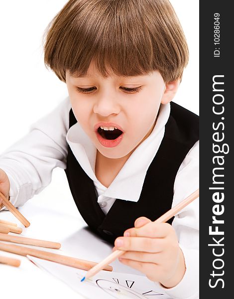 Adorable little boy with pencil, over white