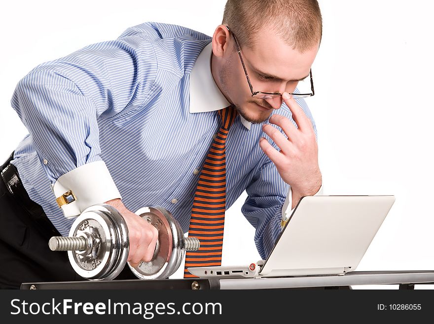 Businessman lifting dumbell with laptop. Businessman lifting dumbell with laptop