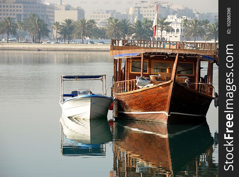 Docked boats in Doha with the city in the background. Docked boats in Doha with the city in the background