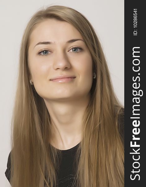 Young sexual girl blonde portrait in a studio on a white background