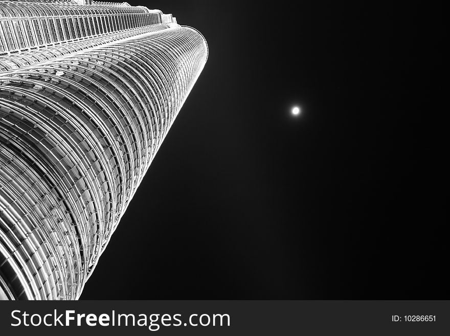 Bright moon in the sky next to the Twin Towers in Kuala Lumpur. Bright moon in the sky next to the Twin Towers in Kuala Lumpur.