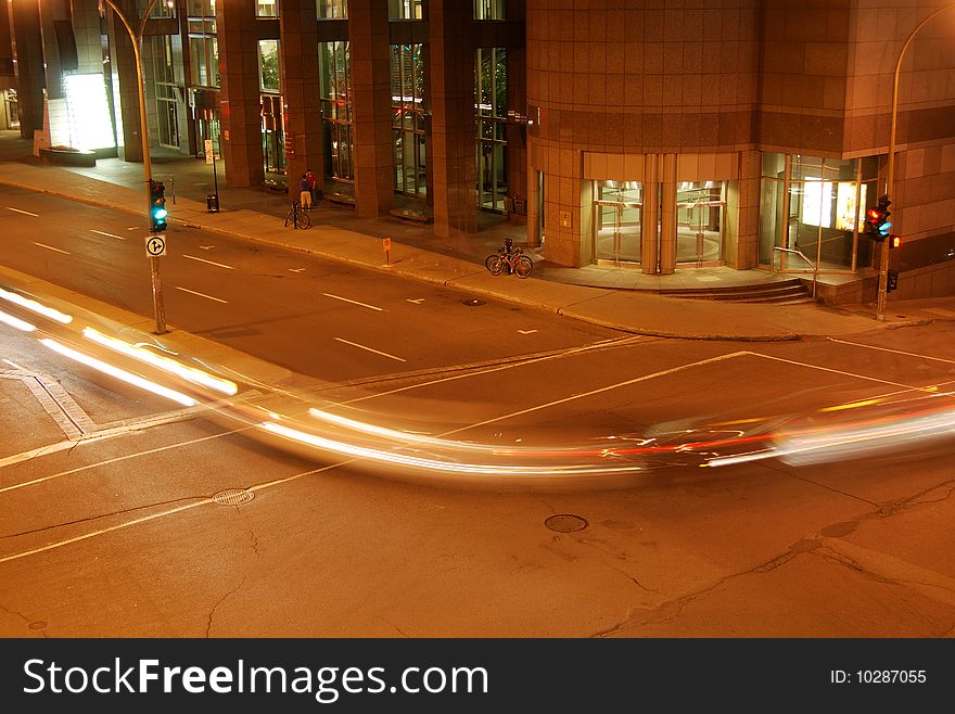 Car lights creating movement and speed effect.  Shot at night in Montreal. Car lights creating movement and speed effect.  Shot at night in Montreal.