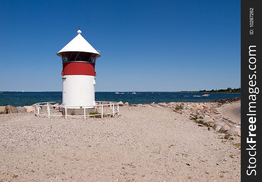 Small Lighthouse by the sea shore