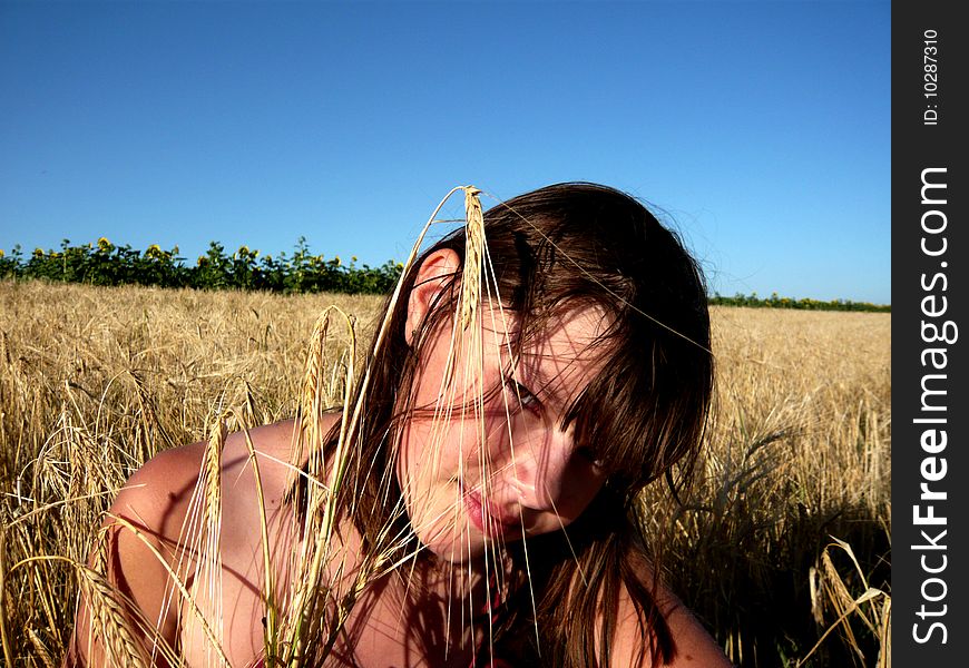 Young girl  with weath on nature