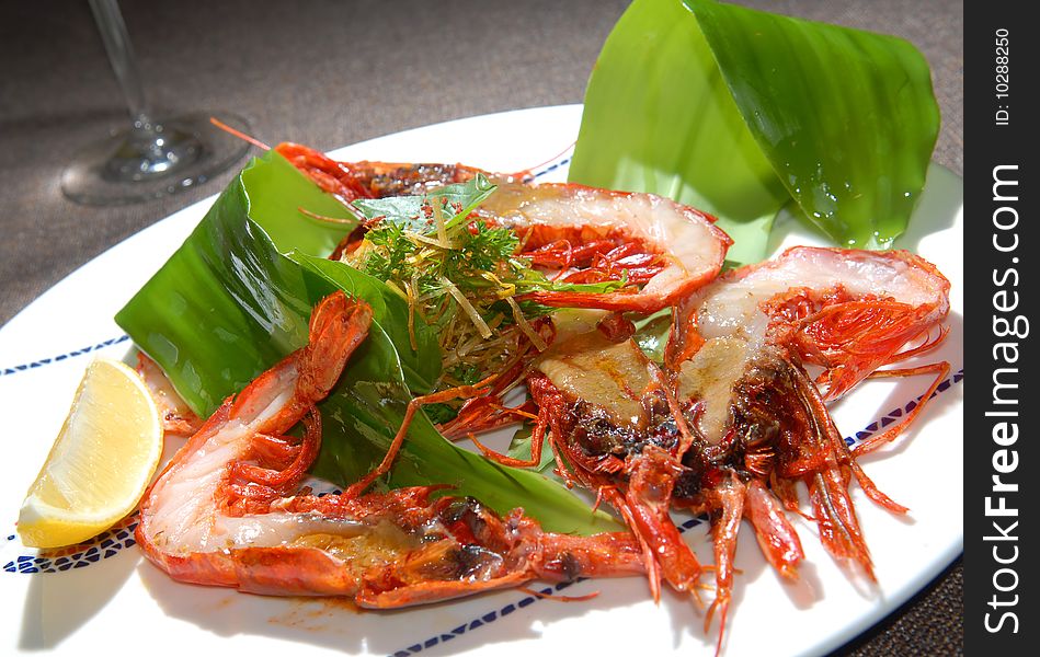 Tiger shrimps fried on a grill with salad