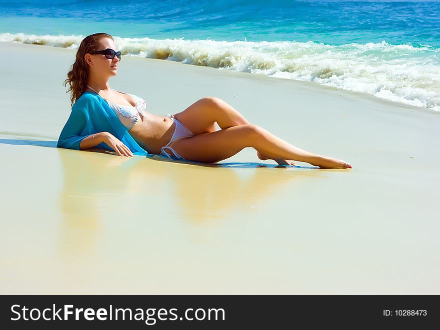 Brunette girl relaxing on the beach