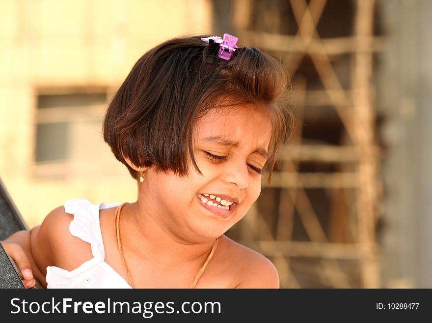 A closeup of a small girl urging to leave her alone. A closeup of a small girl urging to leave her alone.