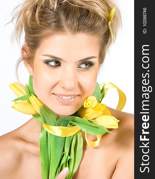 Blonde girl with tulips isolated on white