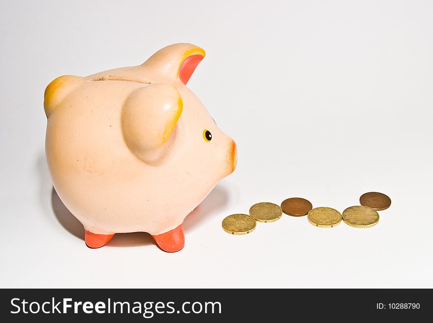 Piggy bank style money box isolated on a white bac