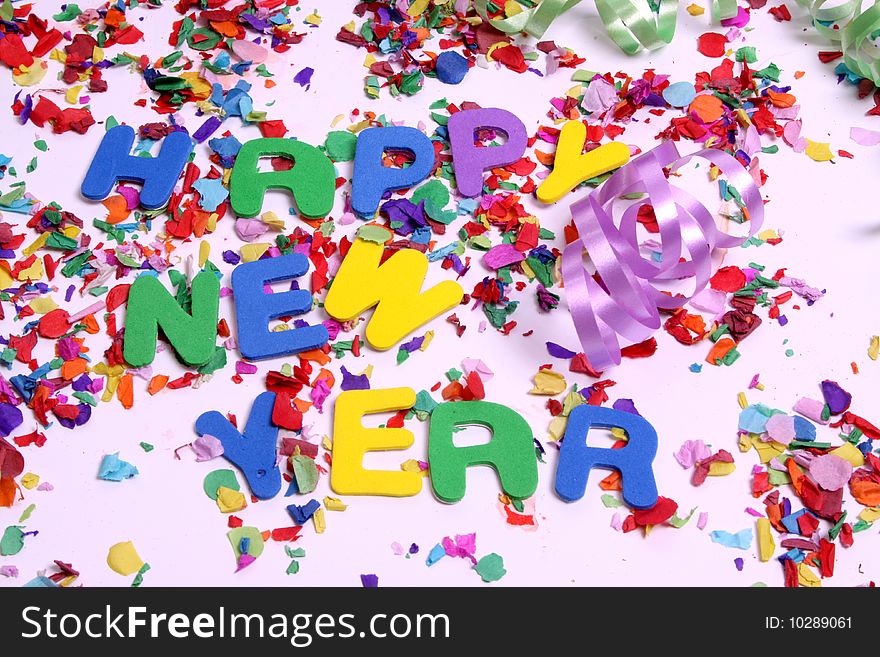 The words Happy New Year to be used as a backgound with confetti
