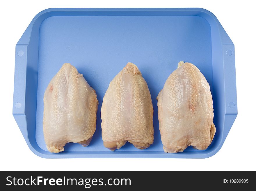 Three chicken breasts on blue plastic tray isolated on white background