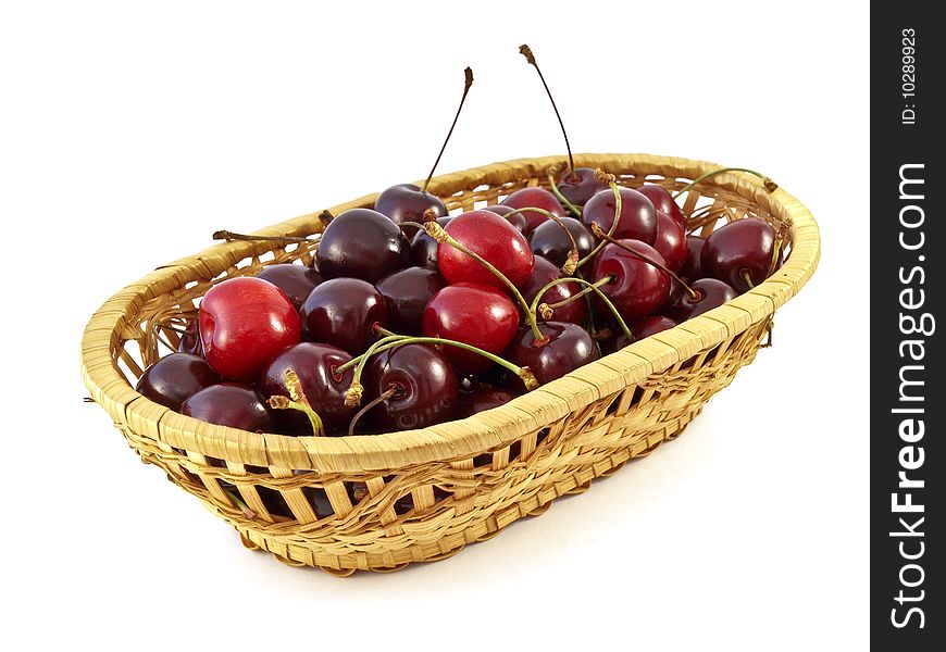 Sweet cherries in basket on white background. Sweet cherries in basket on white background