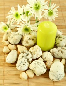 Candle, Stones And Flowers. Stock Photo