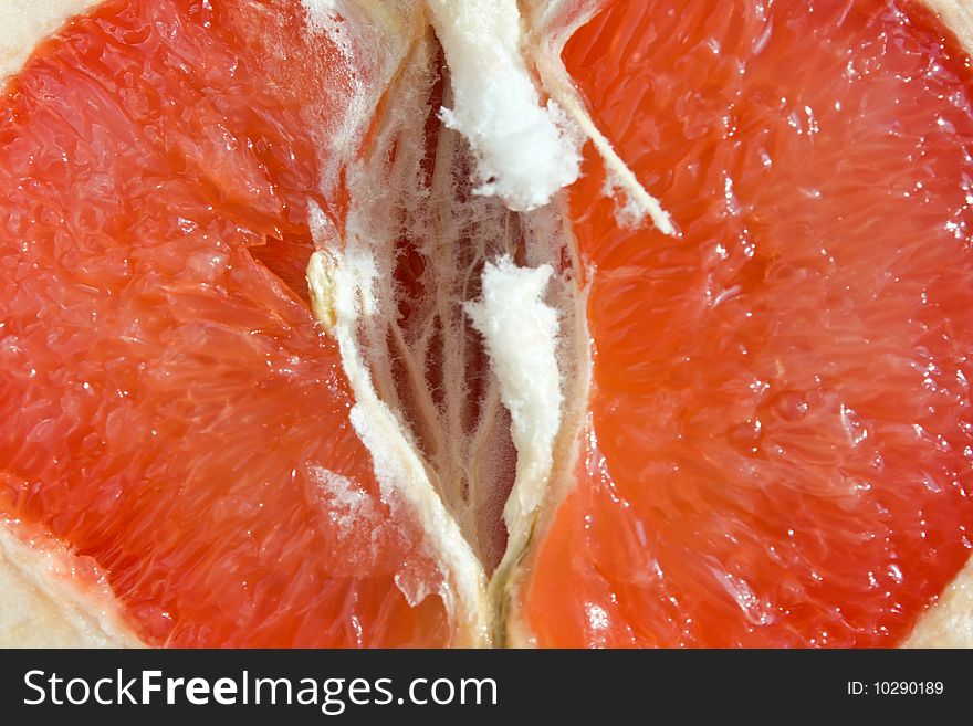 Fresh red grapefruit - organic background