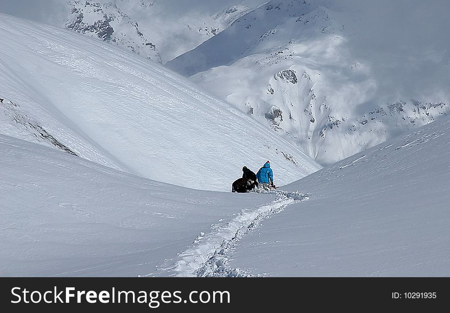 People in a deep snow in the French Alpes
