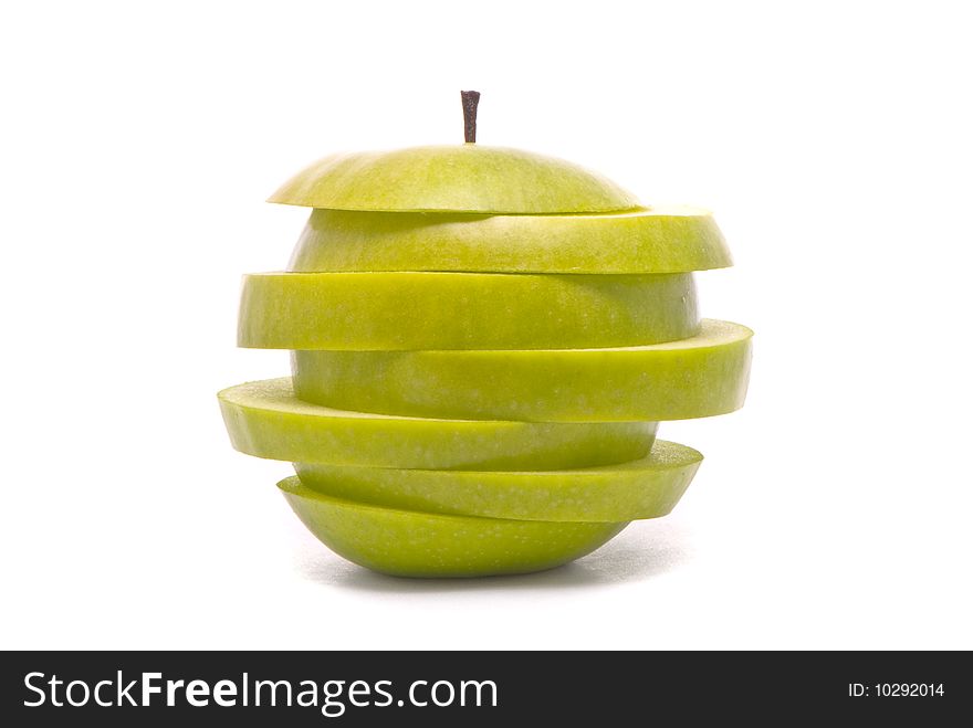 Sliced green apple on studio white