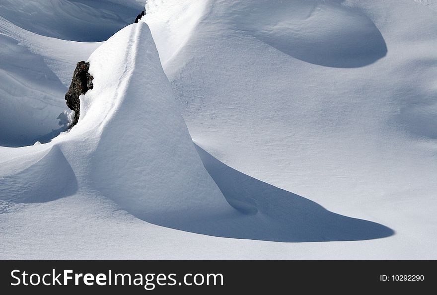 Rock covered with snow in the French Alps. Rock covered with snow in the French Alps