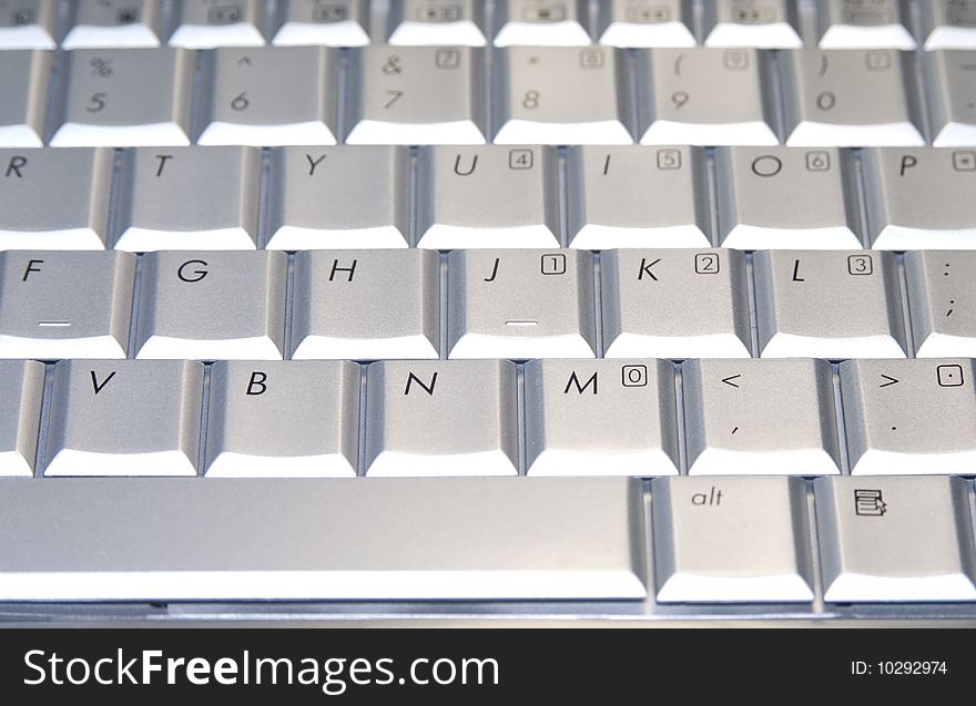 Grey keyboard of a laptop. Grey keyboard of a laptop.