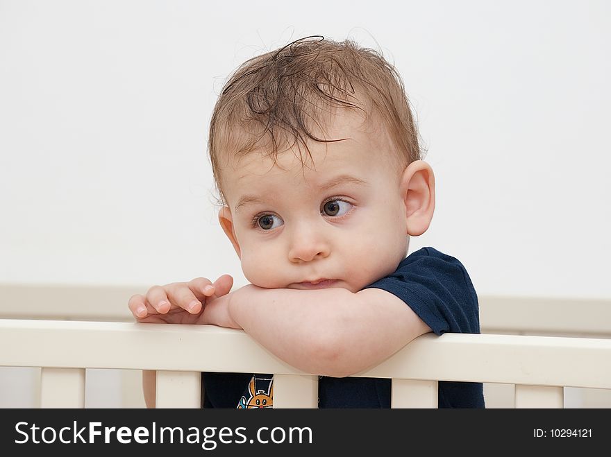 1 year old baby gazing in an invisible spot, while thinking about his future. 1 year old baby gazing in an invisible spot, while thinking about his future.