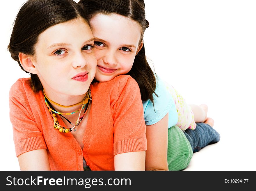 Girls posing and smiling together isolated over white