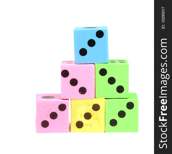 Stack of colorful dices isolated on a white background