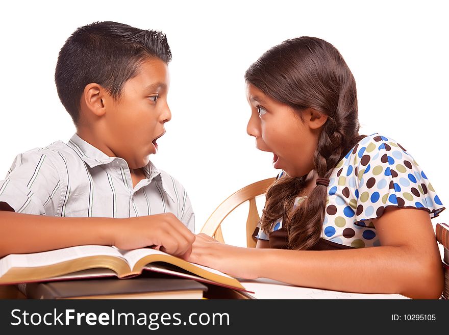 Hispanic Brother and Sister Having Fun Studying Together Isolated on a White Background.