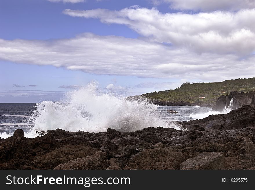 Waves in the volcanic coastline of Pico Island, Azores, Portugal. Waves in the volcanic coastline of Pico Island, Azores, Portugal