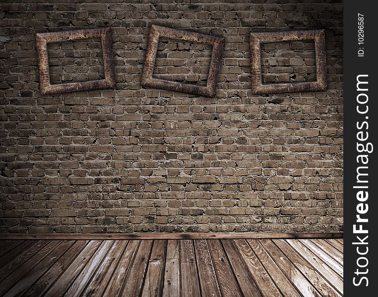 Old grunge interior with blank photo frames against wall. Old grunge interior with blank photo frames against wall