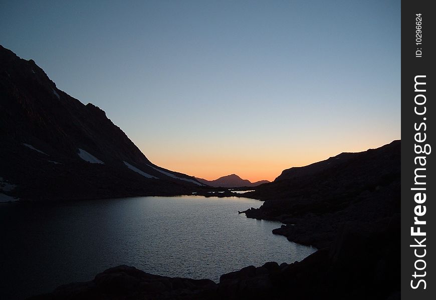 A peaceful evening near a high mountain lake, just after sunset . A peaceful evening near a high mountain lake, just after sunset .