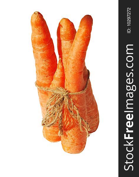 Three carrots tied by string isolated over white