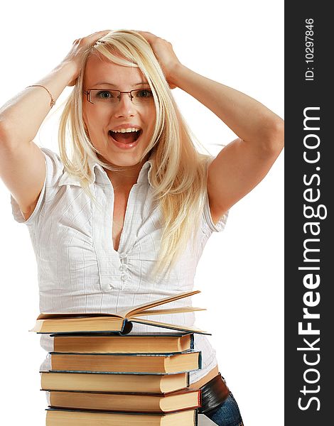 Young girl leaned over pile of books, isolated on white