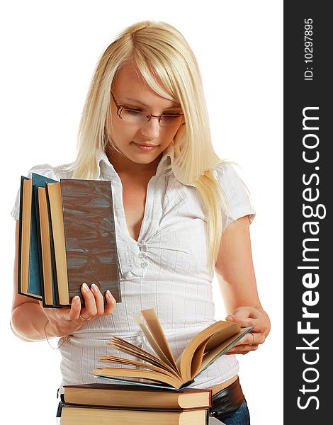 Young girl leaned over pile of books