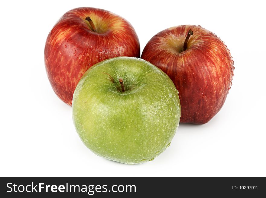 Three apples are photographed on a white background. Three apples are photographed on a white background