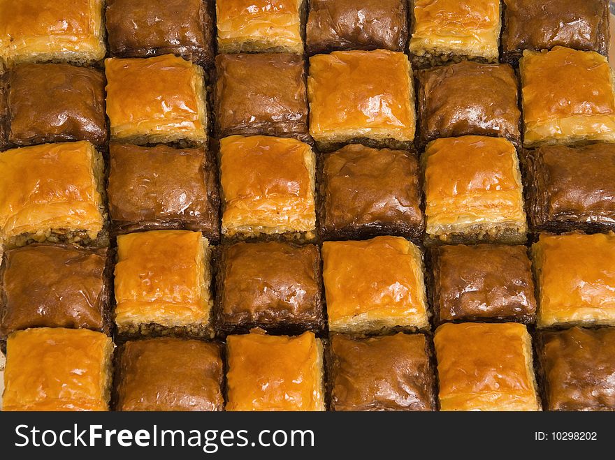 The baklava (a dessert made of thin pastry, nuts, and honey)