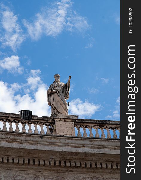 Religious Catholicism sculpture on roof against blue sky. Religious Catholicism sculpture on roof against blue sky