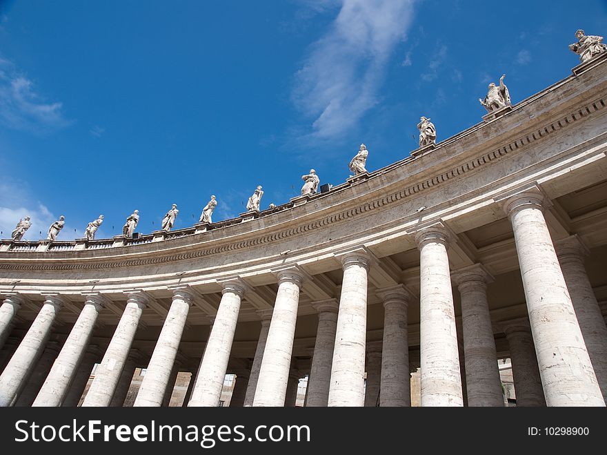 Religious Catholicism sculpture on roof against blue sky. Religious Catholicism sculpture on roof against blue sky