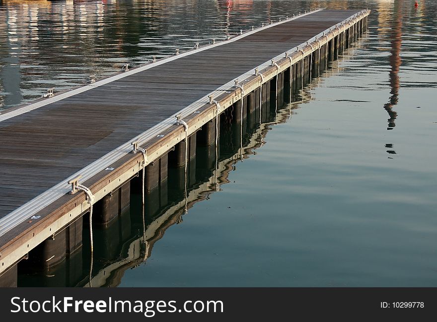 Small wooden pier in the marina. Small wooden pier in the marina.