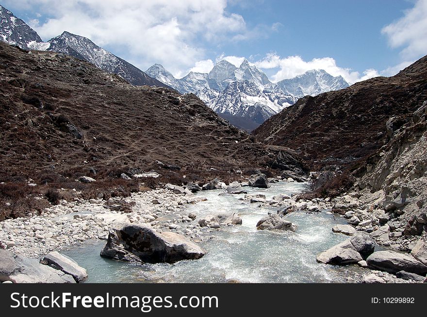 Ama Dablam is a mountain in the Himalaya range of eastern Nepal. The main peak is 6,812 metres (22,349 ft), the lower western peak is 5,563 metres (18,251 ft). Ama Dablam means Mother and Pearl Necklace. Ama Dablam is a mountain in the Himalaya range of eastern Nepal. The main peak is 6,812 metres (22,349 ft), the lower western peak is 5,563 metres (18,251 ft). Ama Dablam means Mother and Pearl Necklace