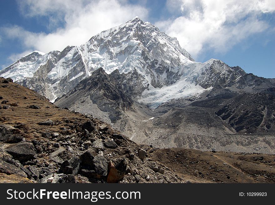 Ama Dablam is a mountain in the Himalaya range of eastern Nepal. The main peak is 6,812 metres (22,349 ft), the lower western peak is 5,563 metres (18,251 ft). Ama Dablam means Mother and Pearl Necklace. Ama Dablam is a mountain in the Himalaya range of eastern Nepal. The main peak is 6,812 metres (22,349 ft), the lower western peak is 5,563 metres (18,251 ft). Ama Dablam means Mother and Pearl Necklace