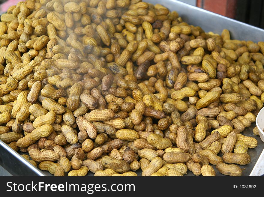 Steamed peanuts on a steaming tray at a highway stop