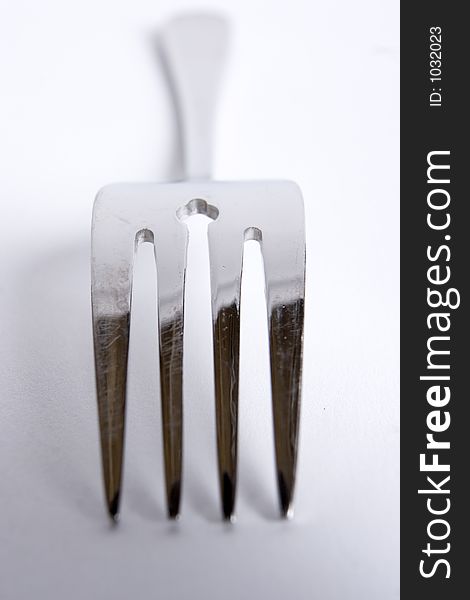 A single fork on a white background. A single fork on a white background