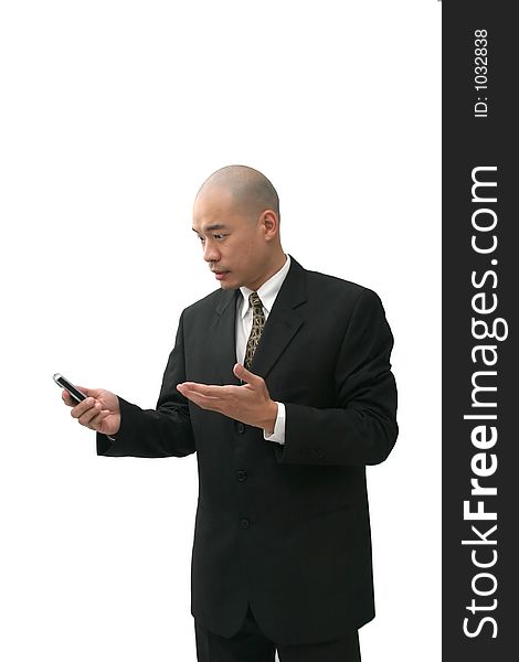 Oriental man in suit on cell phone looking puzzled, angry  or annoyed. Oriental man in suit on cell phone looking puzzled, angry  or annoyed.