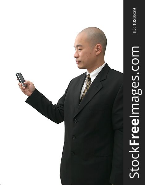 Oriental man in suit on cell phone looking indifferent. Oriental man in suit on cell phone looking indifferent